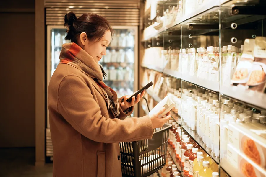 Woman checking label in store